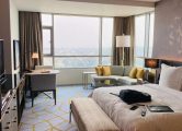 Elegant hotel suite with modern design and city view in Bengaluru.